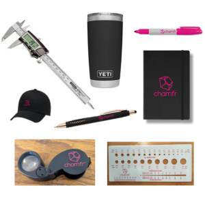 Challenge giveaway package, including a digital caliper, Yeti, pens, notebook, hat, jewlers loupe, and french catheter scale.
